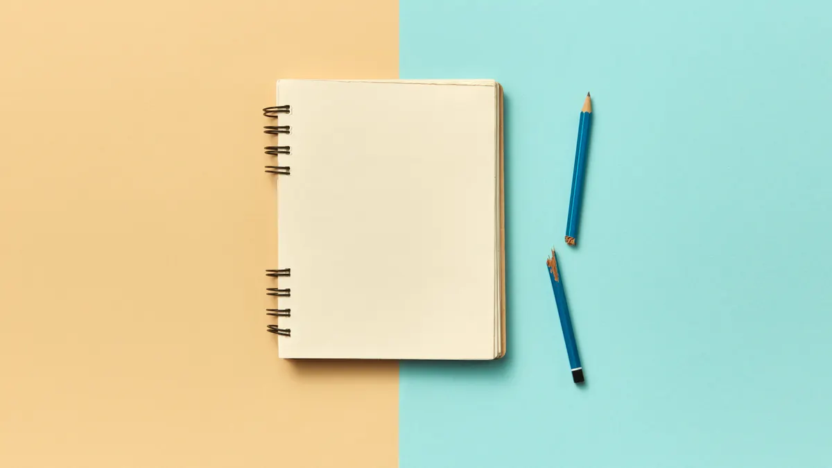 Blank page prompts vs structured journaling: what works better? — A Blank Notebook Page Beside a Broken Pencil on a Beig