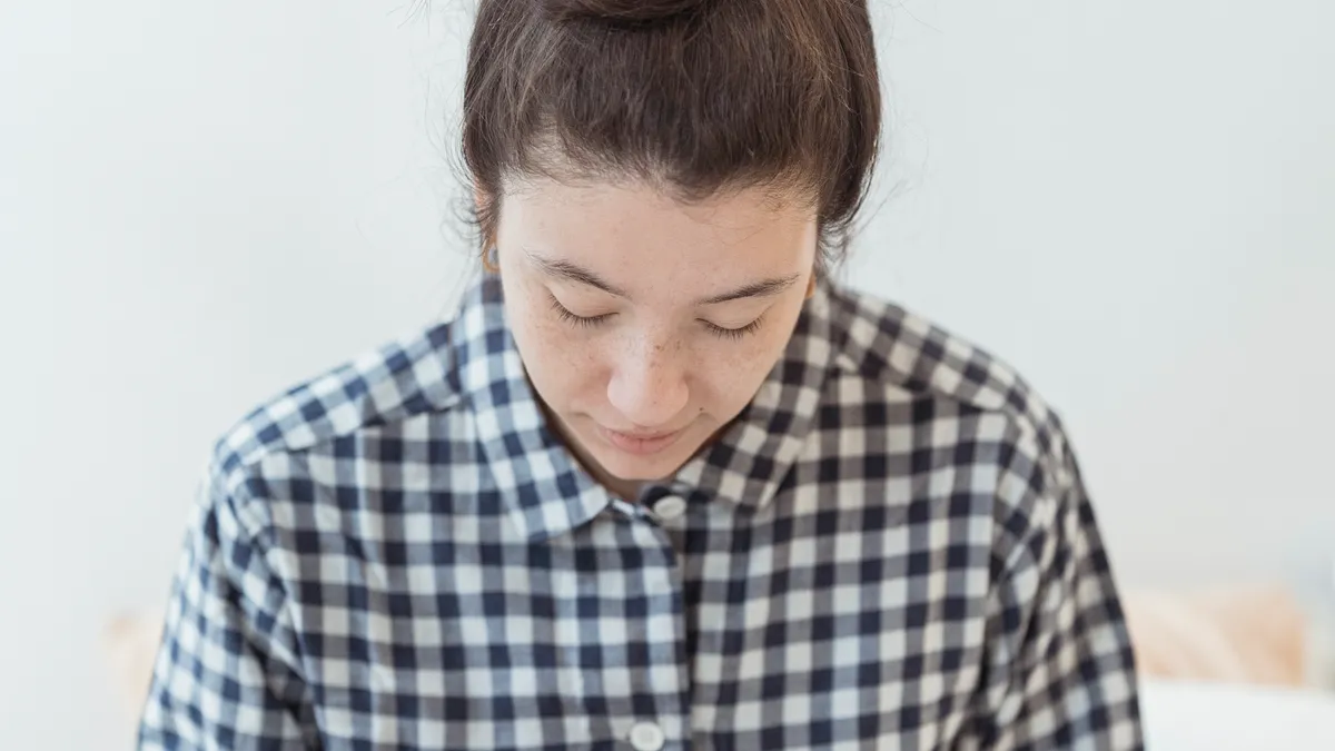 Journal prompts for morning reflection — Woman in Checked Shirt Journaling